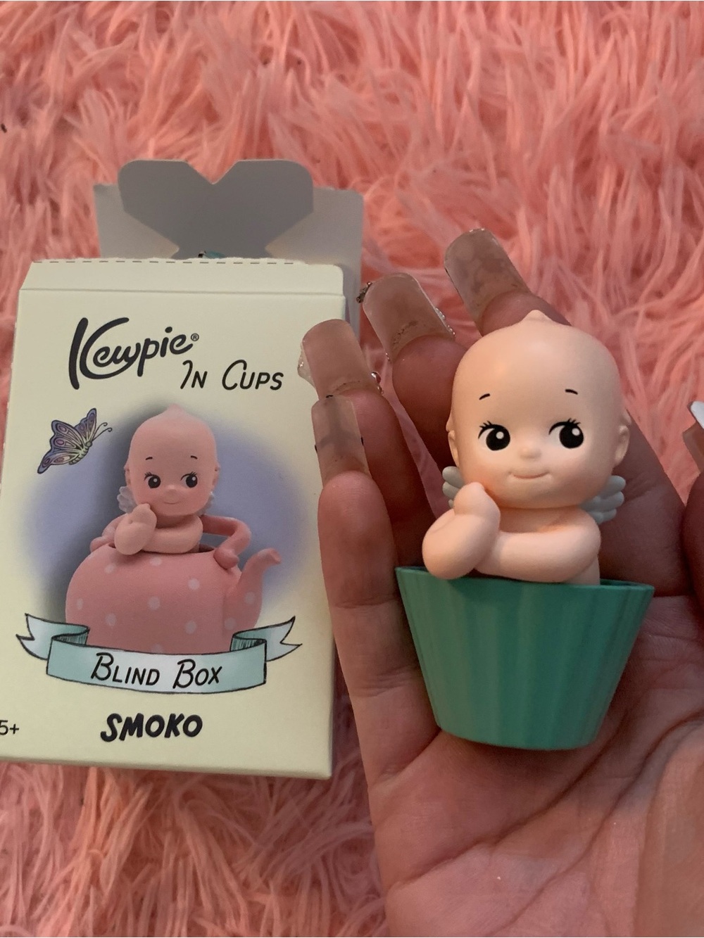 Kewpie in cupcake figurine